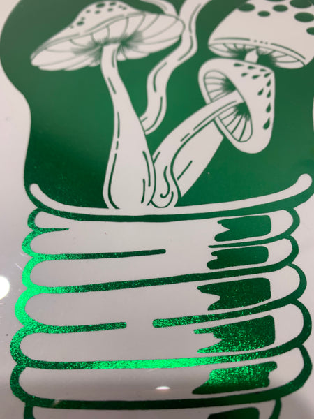 Close up details of Shiny green foil art print. Hand drawn mushroom elements within a light bulb illustration. A4 sized art print.
